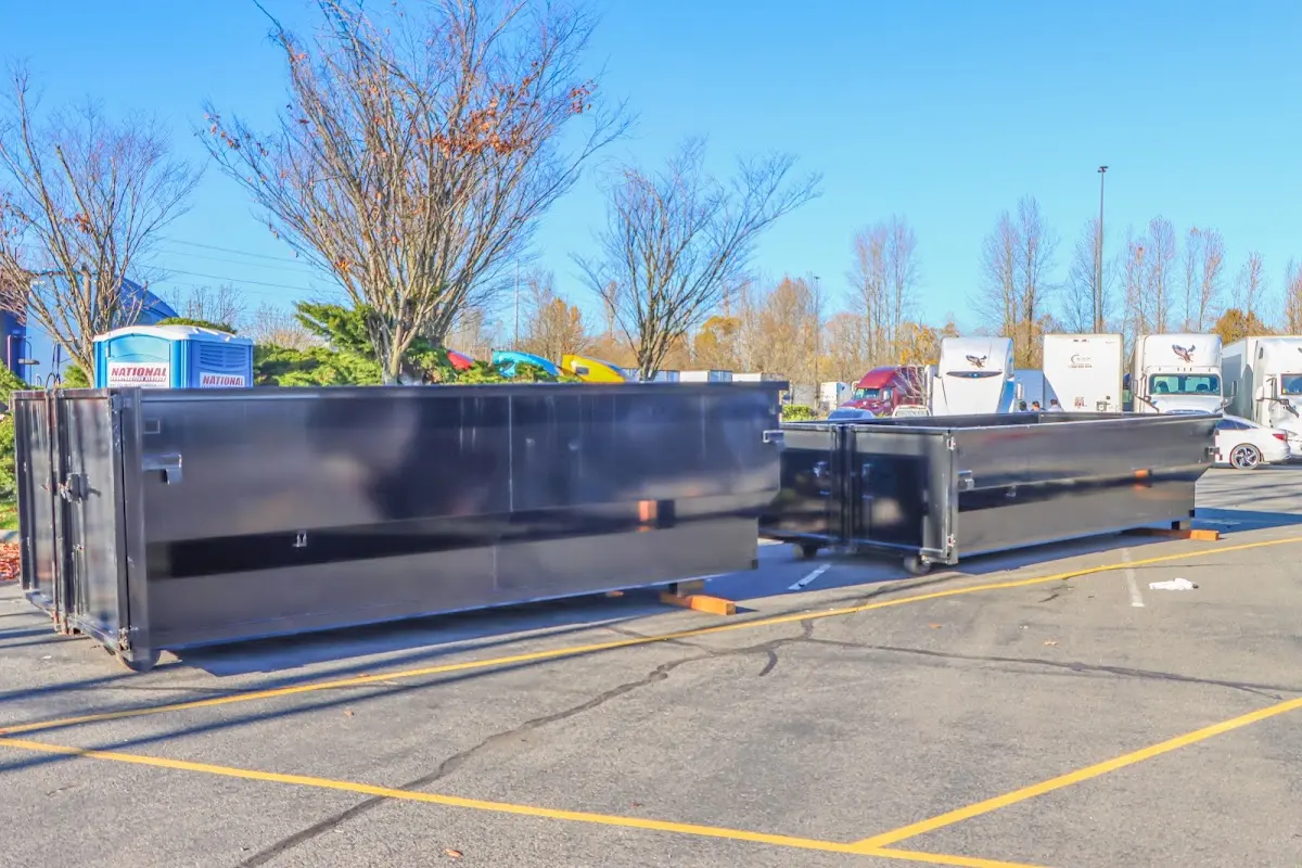 Professional dumpster rental service with roll-off container on residential driveway in Owensboro